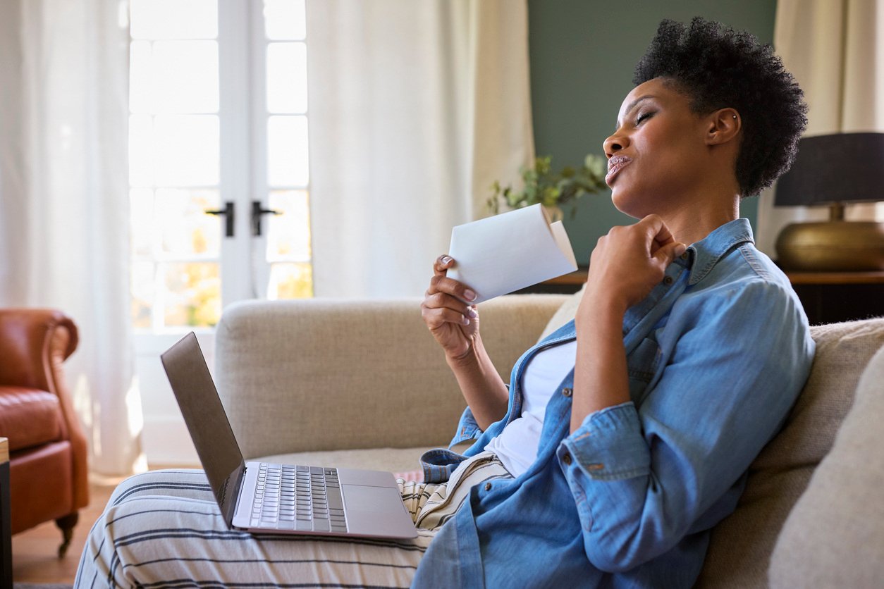 Woman With Laptop Having Hot Flush