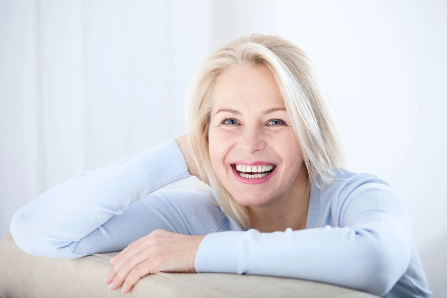 Australian Menopause Centre Active beautiful middle-aged woman smiling friendly and looking in camera. Woman's face closeup.