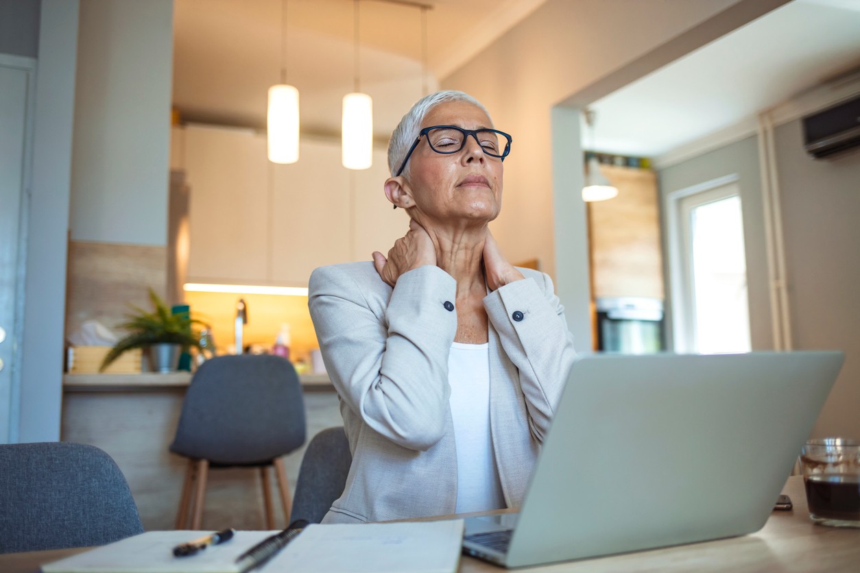 Australian Menopause Centre Cropped shot of a mature businesswoman looking stressed out while working in her office at home.